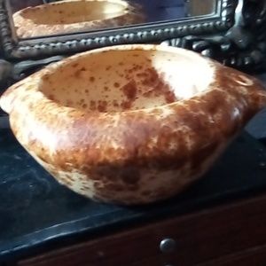 Antique ceramic pottery glazed bowl with hole on each side.